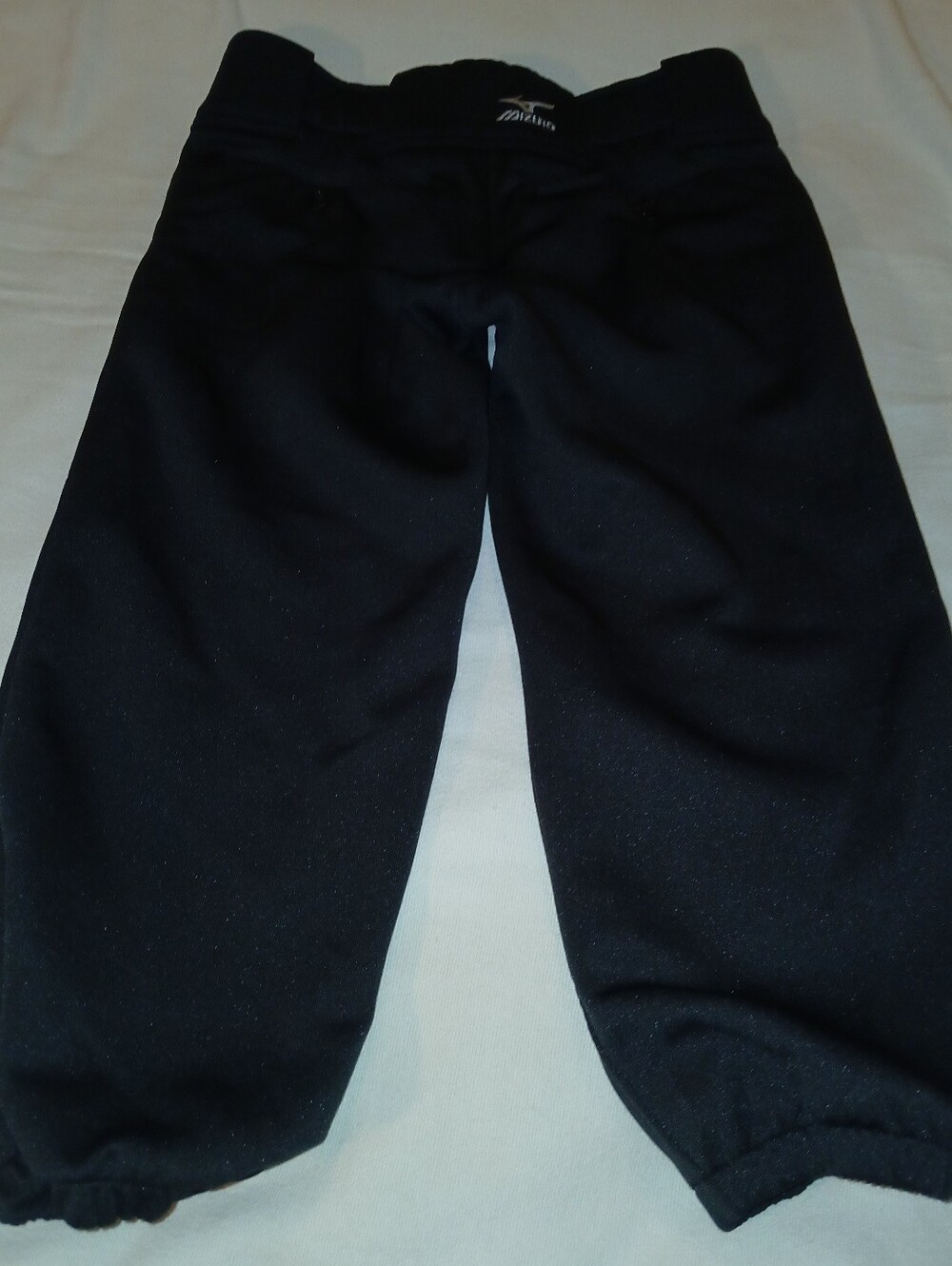 Pre-loved Mizuno Girl's Black Softball Pants Elastic Cuffs.